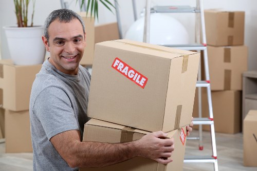 Removal crew loading belongings carefully for a move in Hackney