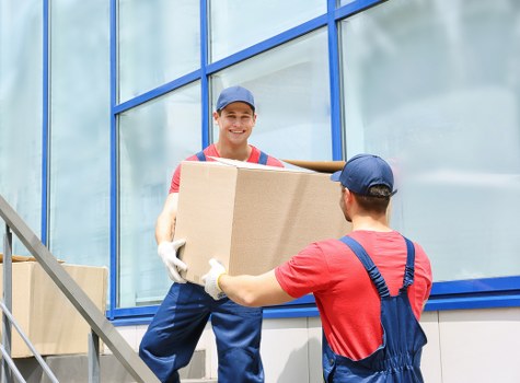 Furniture collection team handling bulky household items in Hackney