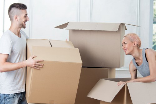 Professional movers handling household items during a Hackney removals service