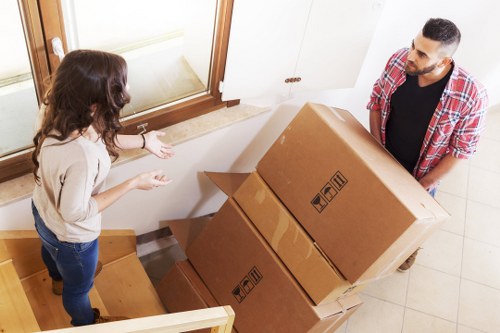 Packed moving boxes and furniture ready for house removals in Hackney