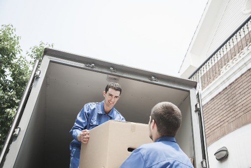 Packed boxes and furniture ready for transport during a local removal