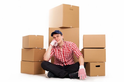 Packed moving boxes and furniture ready for a Hackney home relocation