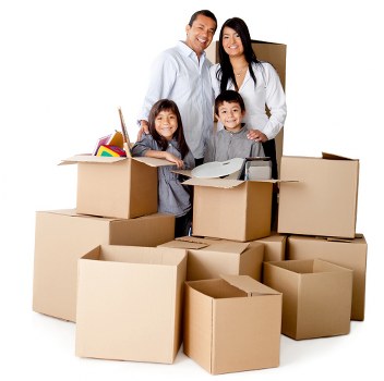 Moving team carrying office items through a Hackney building entrance