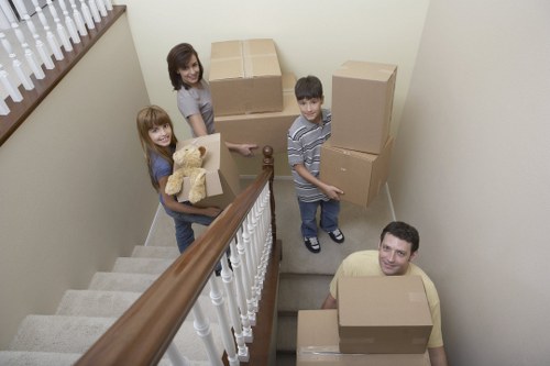 Boxes and office furniture prepared for a business move in east London